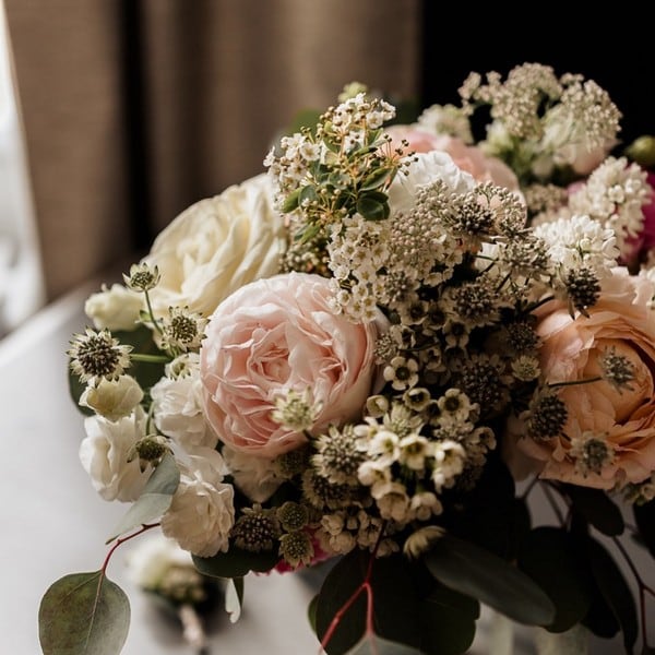 Table centerpiece with purple and white flowers